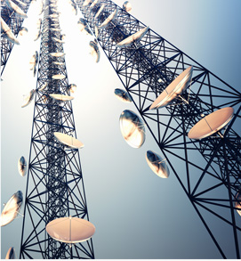 Image of tall telecommunication towers with satellite dishes