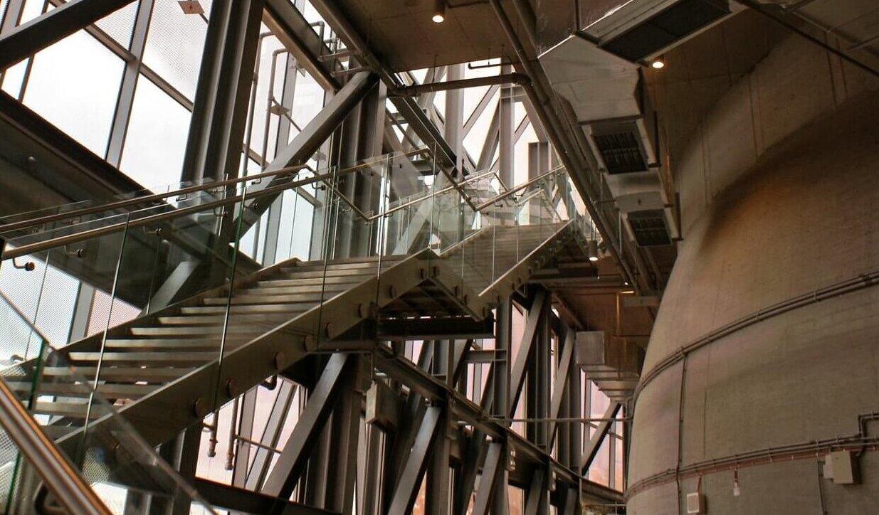 Image of a staircase and windows in an industrial building