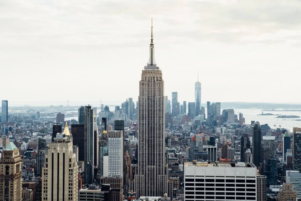 Image of New York City's Empire State Building with many smaller skyscrapers all around